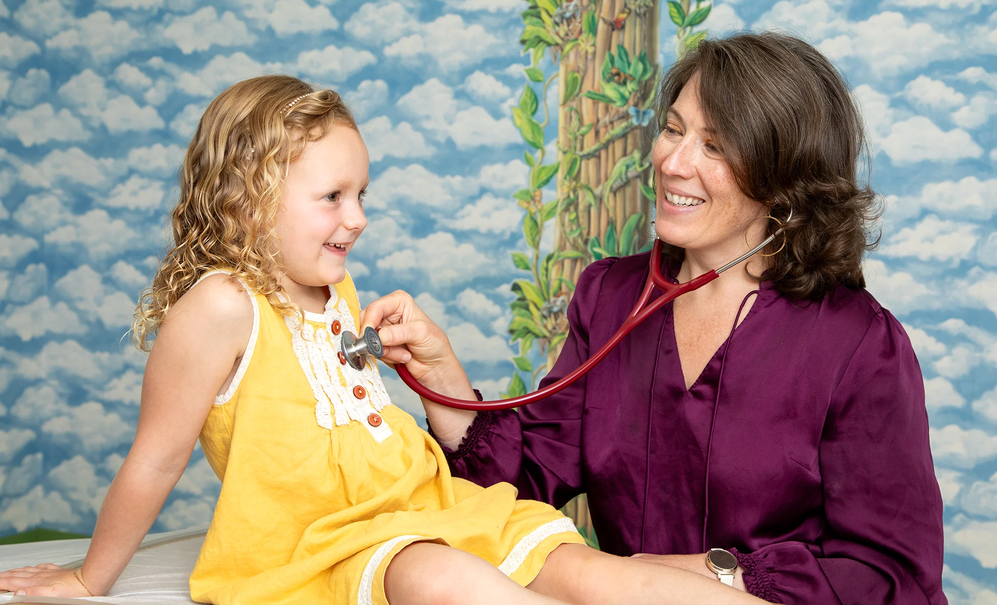 Dr. Fisher and pediatric patient during an exam