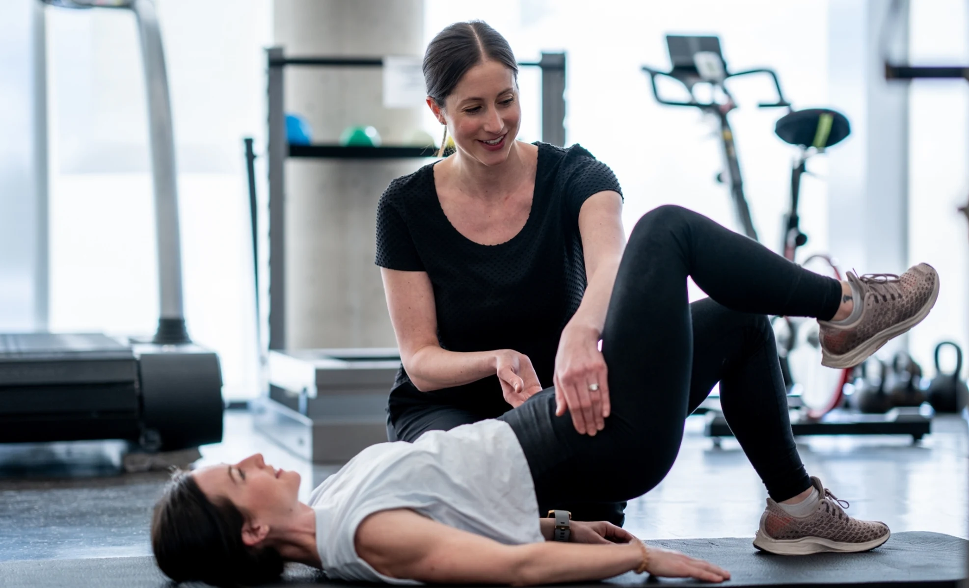 physical therapist with female patient during pelvic floor therapy