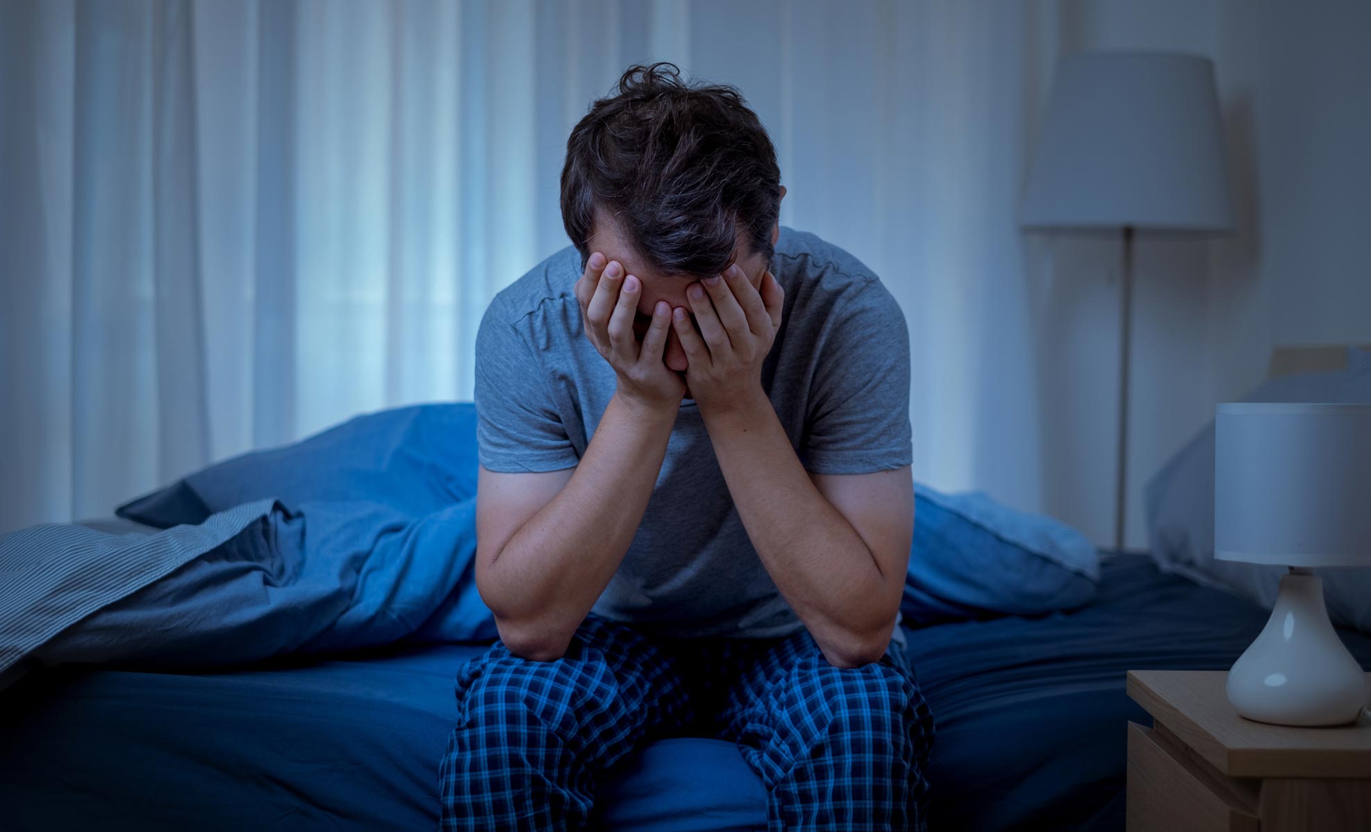 man after a restless night sleep