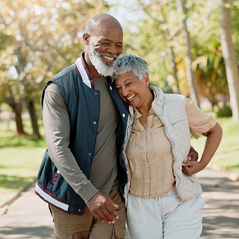 Older couple walking together outdoors