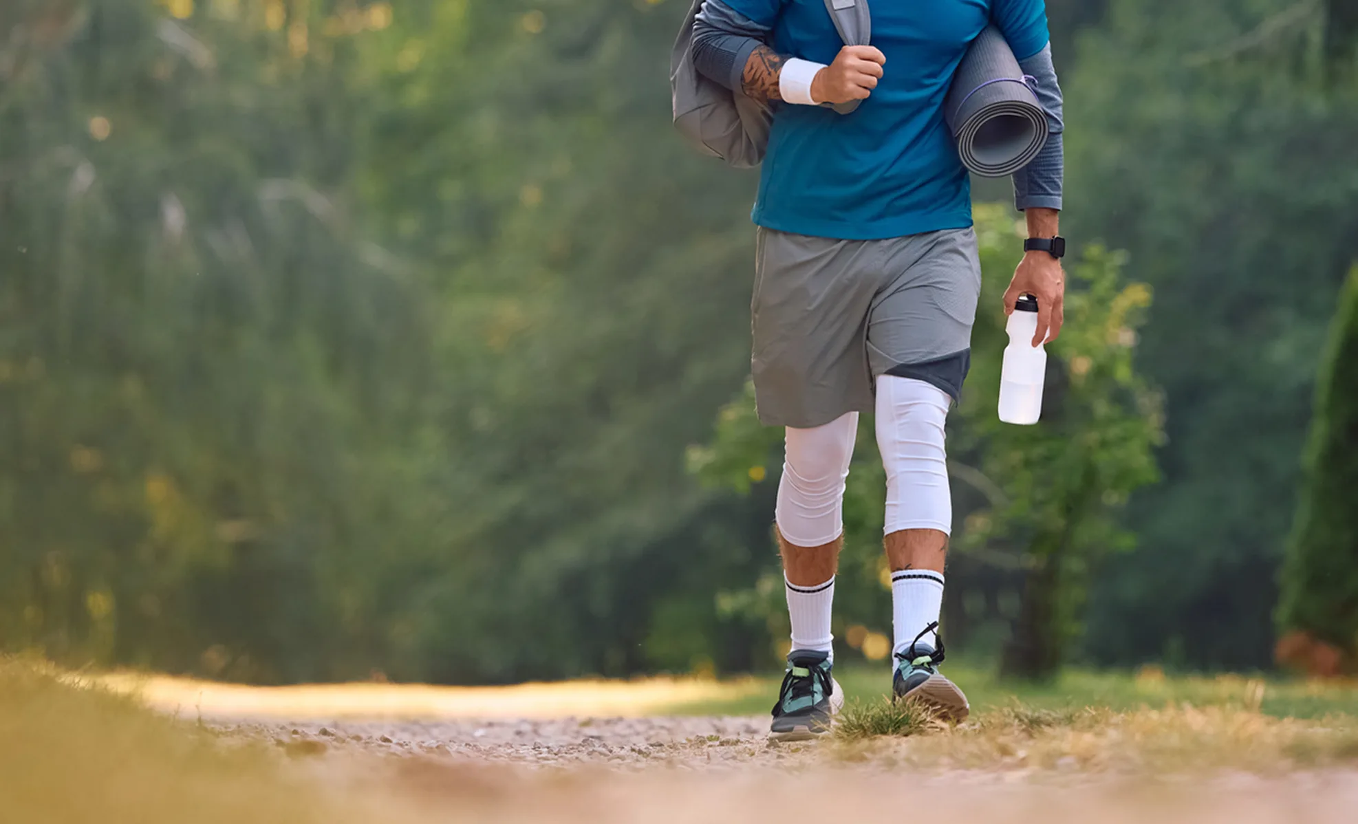 Athlete walking down a trail