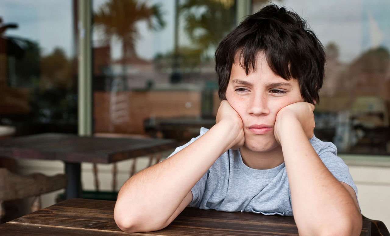Boy frowning