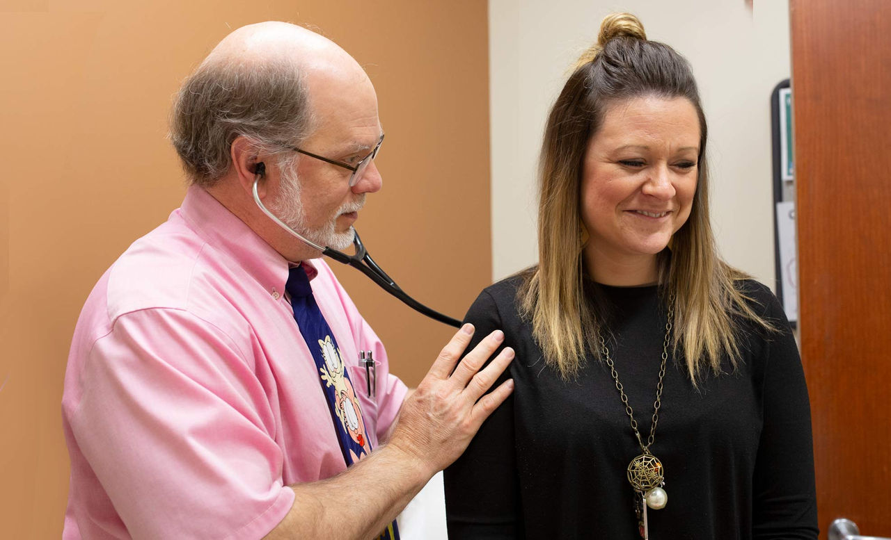 Dr. Bolick with patient during an exam