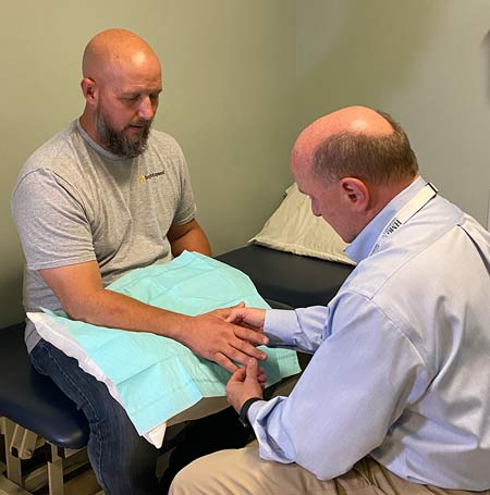Dr. Meade treating Byron's hand
