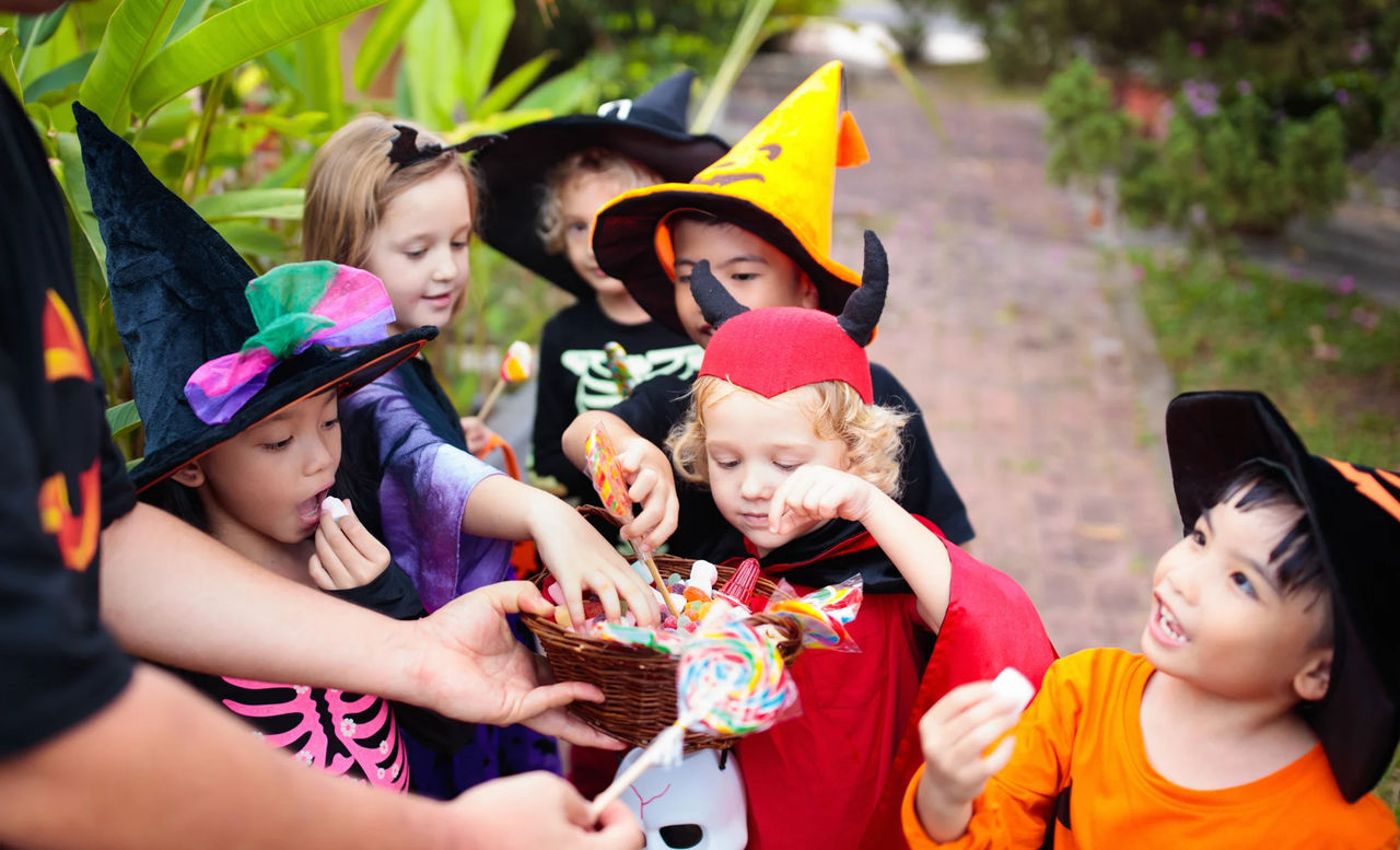 kids getting candy on Halloween