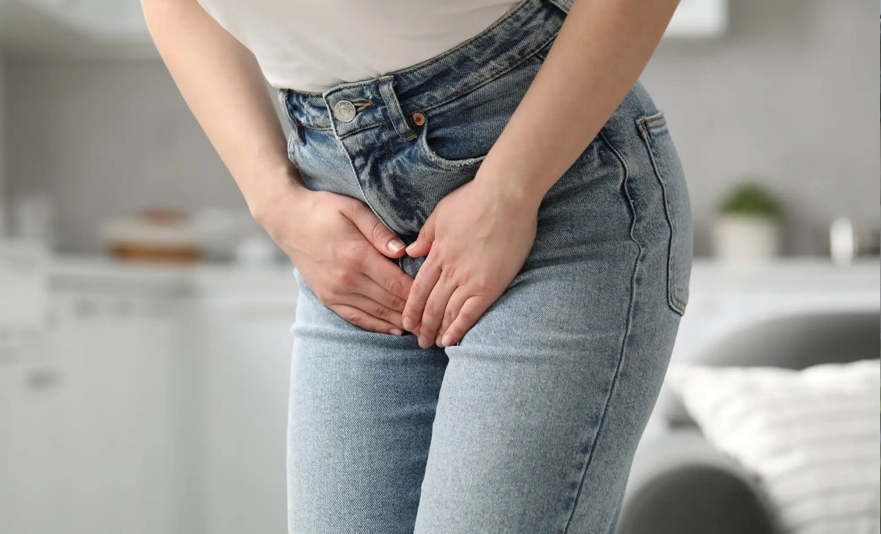 image of a woman holding her bladder