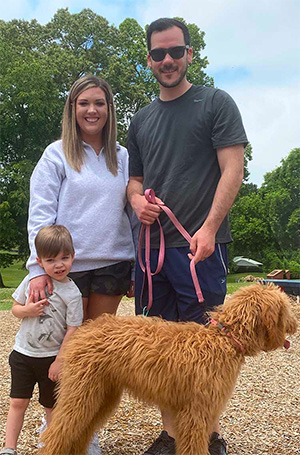 Dr. Metzger and family at the park with Ivy, their dog