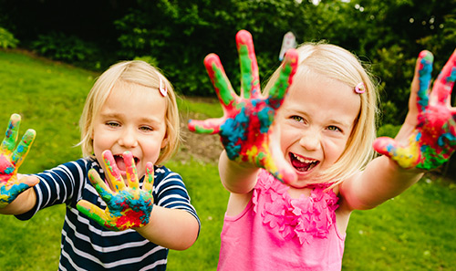 kids with finger paint