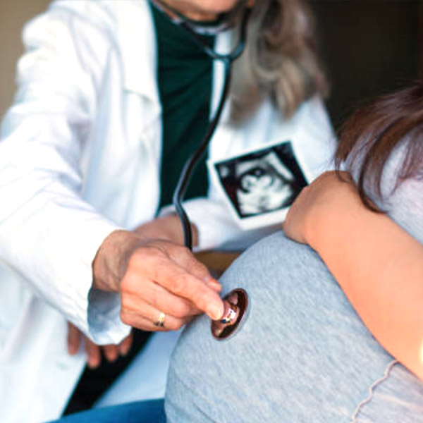 Pregnant woman being examined by health care provider
